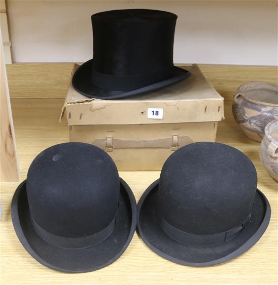 Two moleskin top hats and two bowler hats